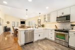 Open kitchen, dining, and living space is bright and welcoming 